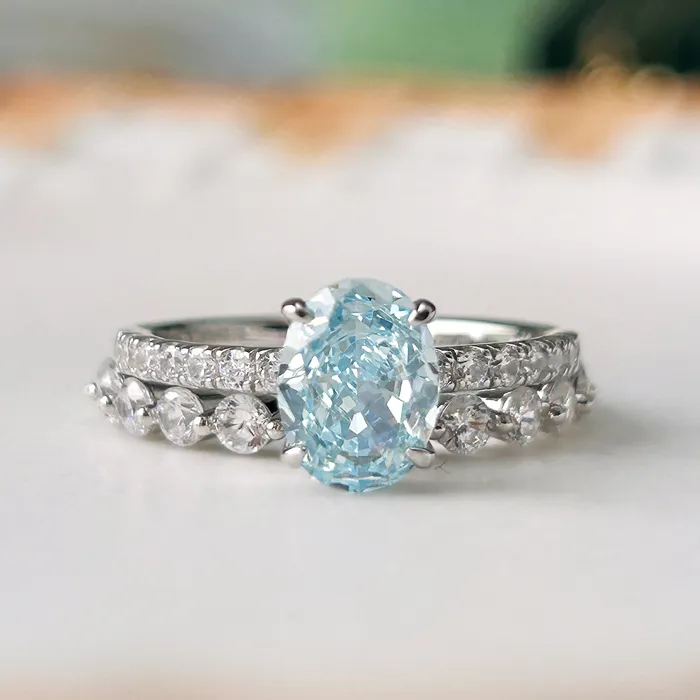 Rings Carly Jewelry 2 Pcs Stunning Blue Oval Cut Sterling Silver Bridal Set